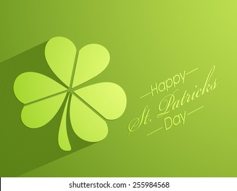 Happy St. Patrick's Day celebration with creative glossy shamrock leaf on green background.