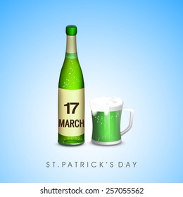 Happy St. Patrick's Day celebration with beer bottle and mug on blue background.