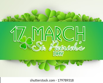 Happy St. Patricks Day celebrations concept with stylish text decorated by Irish lucky four leaf clover on abstract grey background.