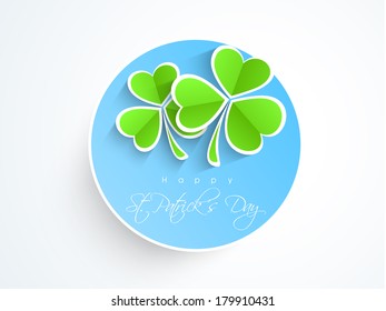 Happy St. Patrick's Day celebrations sticker, tag or label design decorated by green Irish lucky shamrock leaves on blue.