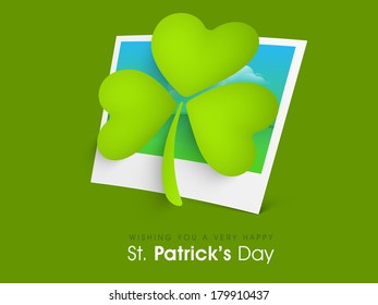 Happy St. Patrick's Day celebrations concept with beautiful lucky Irish shamrock leaf on a photo.