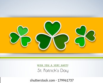 Happy St. Patrick's Day celebrations flyer, banner or poster design with beautiful green Irish lucky shamrock leaves on yellow and blue background. 