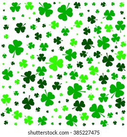 Happy St. Patrick's Day clover greeting background. Pattern of shamrock leaves on white background for holiday celebration.  Vector illustration.

