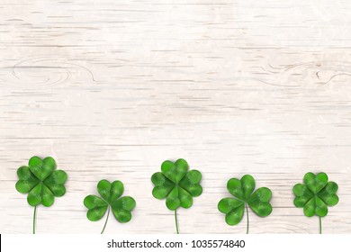 Happy St. Patrick's day. St patricks day design with shamrock clover leaf, Irish festival symbol on wooden background. Space for your text. Design for banner, card, poster, invitation, postcard