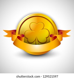 Happy St. Patrick's Day green background with golden coin and ribbon.