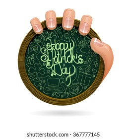 Happy St. Patrick's Day greetings written on round chalkboard held by man's hand