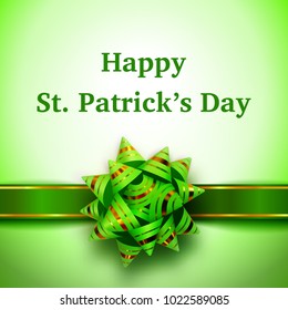 Happy St. Patrick's Day holiday banner with green ribbon and bow with gold stripes