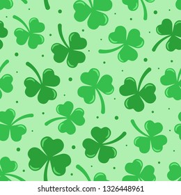 Happy St. Patrick's day vector seamless pattern. Green clover with dots on light green background. Perfect for wrapping paper or textile.