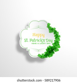 Happy St. Patrick's Day vector card on the gradient gray background with label cut from paper, shadow, text and clover leaves arranged at the border.