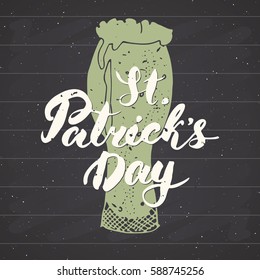 Happy St Patrick's Day Vintage greeting card Hand lettering on beer cup silhouette, Irish holiday grunge textured retro design vector illustration on chalkboard background.