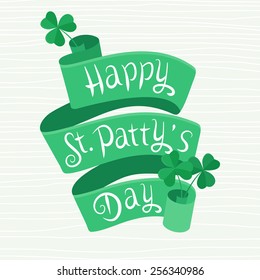 Happy St. Patty's Day vector lettering on a green ribbon with shamrock in retro style