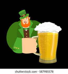 Happy St.Patrick 's Day. Leprechaun and mug beer. Dwarf with red beard mug ale. Holiday in Ireland