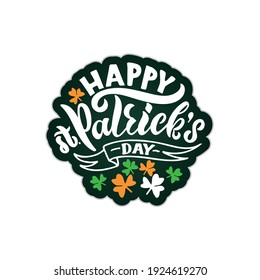 Happy St.Patrick's Day sticker with handwritten text. Hand lettering, modern brush calligraphy isolated on white background with ribbon and clover leaves. Vector illustration for card, logo,  print