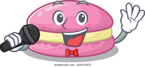 Feliz canto de macarones de fresa en el micrófono