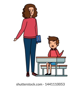happy student boy in schooldesk with female teacher