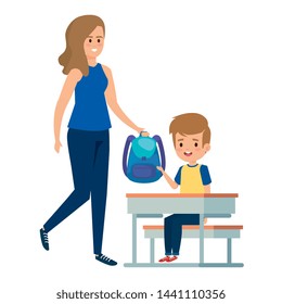 happy student boy in schooldesk with female teacher