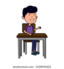 happy student boy seated in school desk