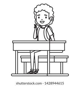 happy student boy seated in school desk