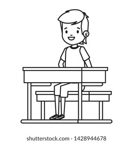 happy student boy seated in school desk