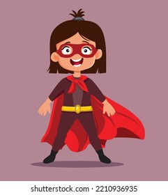 

Happy Super Little Girl Wearing a Red Cloak and Hero Costume. Cool independent child having superpowers feeling strong
