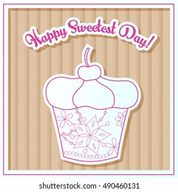Happy sweetest day card with cupcake on cardboard