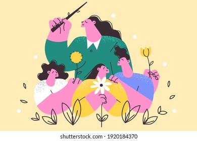 Happy teachers day celebration concept. Young smiling female teacher cartoon character standing over smiling children pupils vector illustration in classroom or outdoors