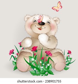 Happy Teddy bear sits in a meadow flowers