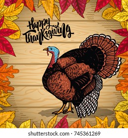 Happy thanksgiving. Border from autumn leaves on wooden background. Turkey illustration. Design element for poster, emblem, banner, card. Vector illustration