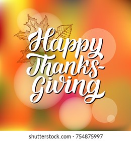 Happy thanksgiving brush hand lettering with sketched maple leaves, on orange blurred background. Calligraphy vector illustration for holiday type design