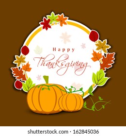 Happy Thanksgiving Day celebration greeting card or gift card with pumpkins, maple leaves, and space for your text on brown background. 