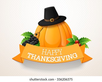 Happy Thanksgiving Day celebration with pumpkin, pilgrim hat, grapes, mistletoe and ribbon.