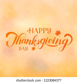 Happy Thanksgiving Day hand written with brush. Calligraphy lettering and fall maple leaves on autumn gradient background. Easy to edit vector template for greeting card, banner, party invitation.  
