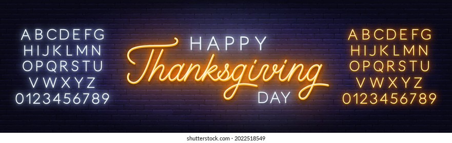 Happy thanksgiving day neon sign. Greeting card on brick wall background