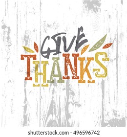 Happy Thanksgiving design. Give Thanks Logo. For holiday greeting cards designs. On wooden texture background