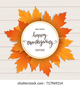 Happy Thanksgiving . Sale banner for Thanksgiving Day. Hand Lettering on the wooden background with trendy autumn foliage.