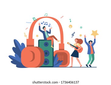 Happy tiny people listening spiritual music near huge headphones flat vector illustration. Young guy holding star and girl playing guitar. Lifestyle and technology concept
