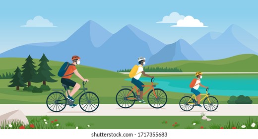 Happy traveling family spending time outdoors, they are cycling together in nature and wearing protective face masks