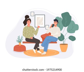 Happy two women sitting in the couch drinking coffee and talking at home. Smiling character spending time together. Vector illustration friendly conversation concept