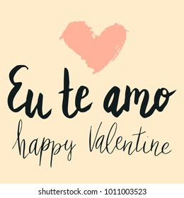 Happy valentine lettering Eu te amo (I love you in Spanish) hand written with dry brush heart shape.