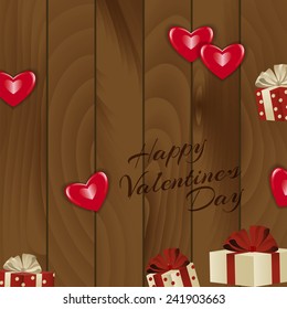 Happy Valentine's Day background. red hearts and gift boxes on wood texture