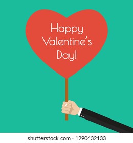 Happy Valentine's day banner in flat style. Hand holding a heart with with Valentine greeting. Vector illustration.