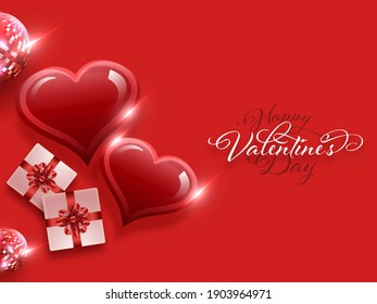 Happy Valentine's Day Calligraphy With Top View Of Glossy Hearts, Gift Boxes And Disco Balls On Red Background.