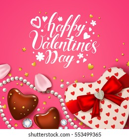 Happy Valentines Day card with realistic rose petals, chocolate, gift heart shaped box, pearl and diamonds. Handwritten inscriptions. Pink background. Modern brush calligraphy.