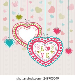 Happy Valentines Day celebration with beautiful hanging hearts on stylish background.