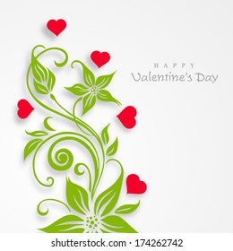 Happy Valentines Day celebration concept with beautiful love plant decorated by pink hearts and green leaves on grey background. 