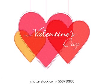 Happy Valentine's Day celebration with creative hearts hanging on white background.