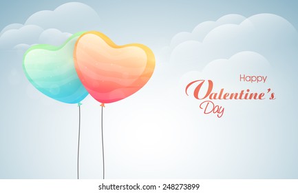 Happy Valentines Day celebration with glossy balloons in heart shape on cloudy background.