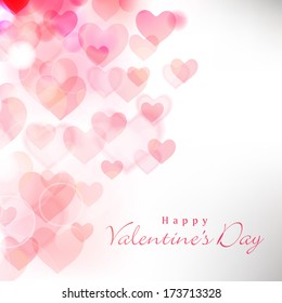 Happy Valentines Day celebration greeting card decorated with pink heart shape on grey background. 