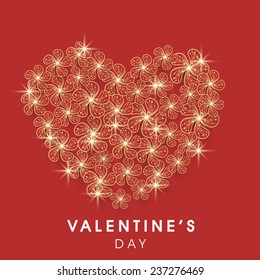 Happy Valentine's Day celebration greeting card with beautiful heart made by shiny golden flowers on red background.
