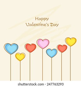 Happy Valentine's Day celebration greeting card decorated by colorful heart shape flowers.
